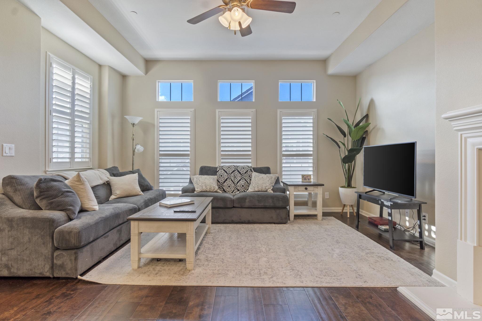 1705 Wind Ranch Road, Unit C Reno, NV 89521 - Photo 11 of 26 a living room with furniture and a flat screen tv
