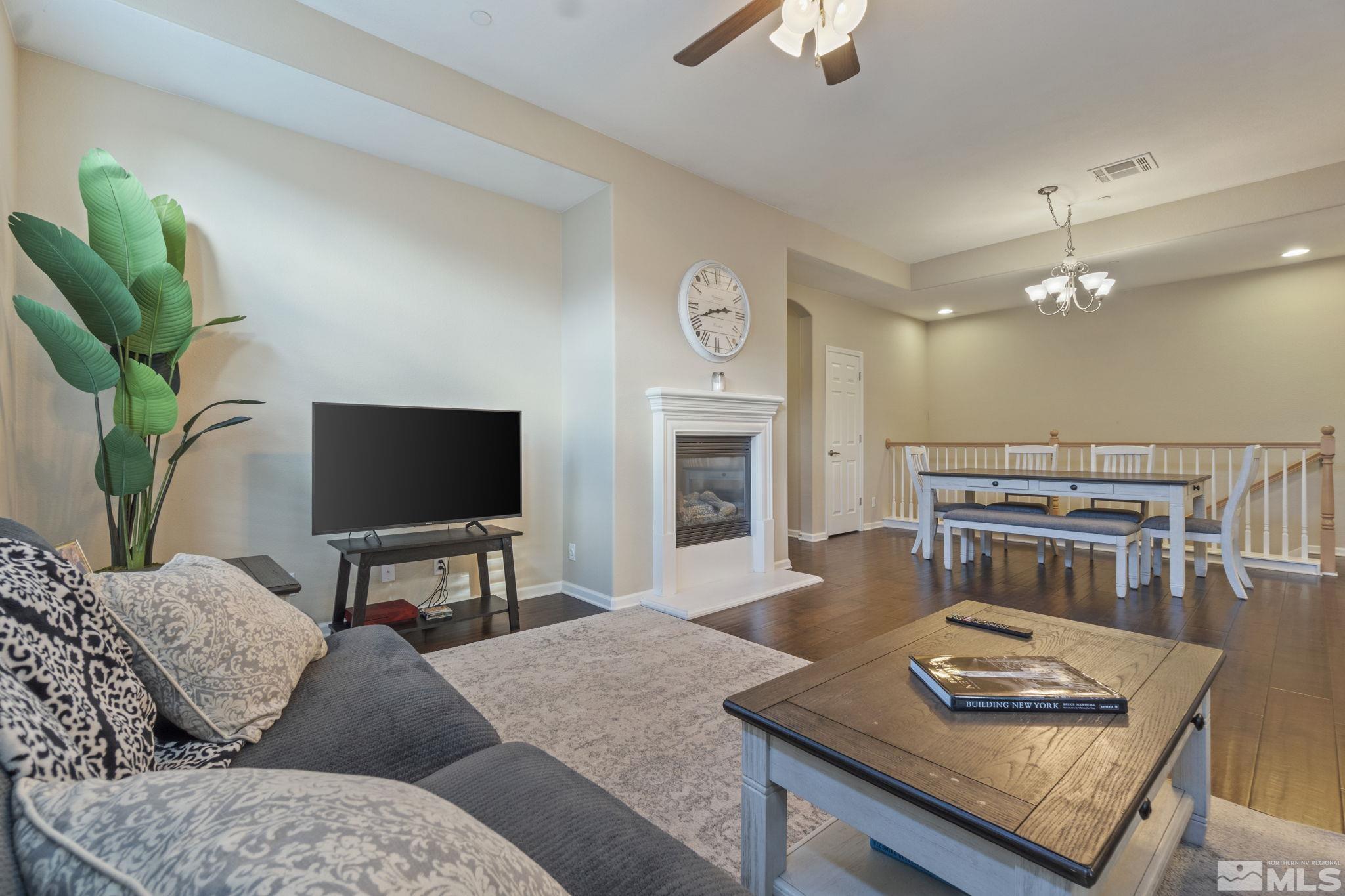 1705 Wind Ranch Road, Unit C Reno, NV 89521 - Photo 15 of 26 a living room with furniture and a flat screen tv