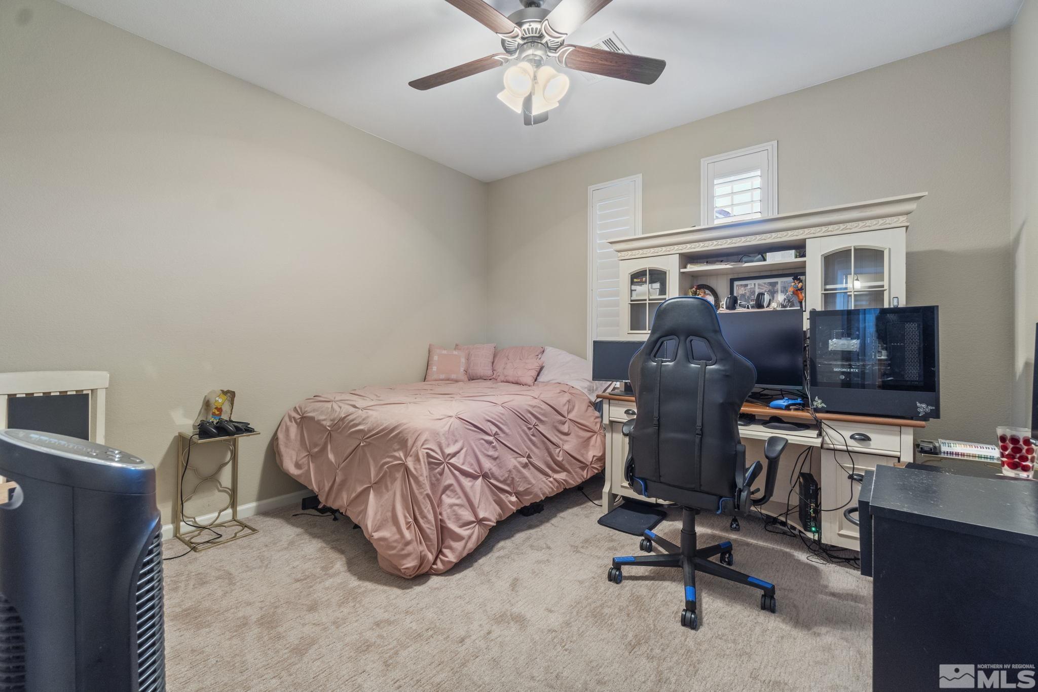 1705 Wind Ranch Road, Unit C Reno, NV 89521 - Photo 24 of 26 a bedroom with a workspace