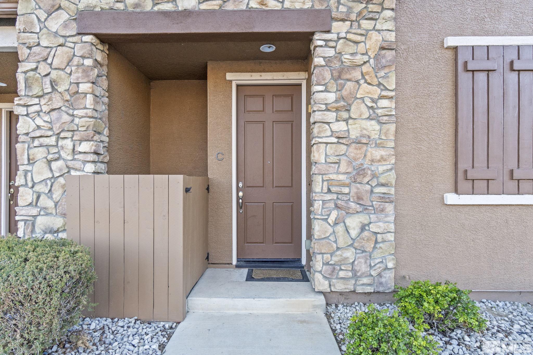 1705 Wind Ranch Road, Unit C Reno, NV 89521 - Photo 4 of 26 view of a entryway door front of house
