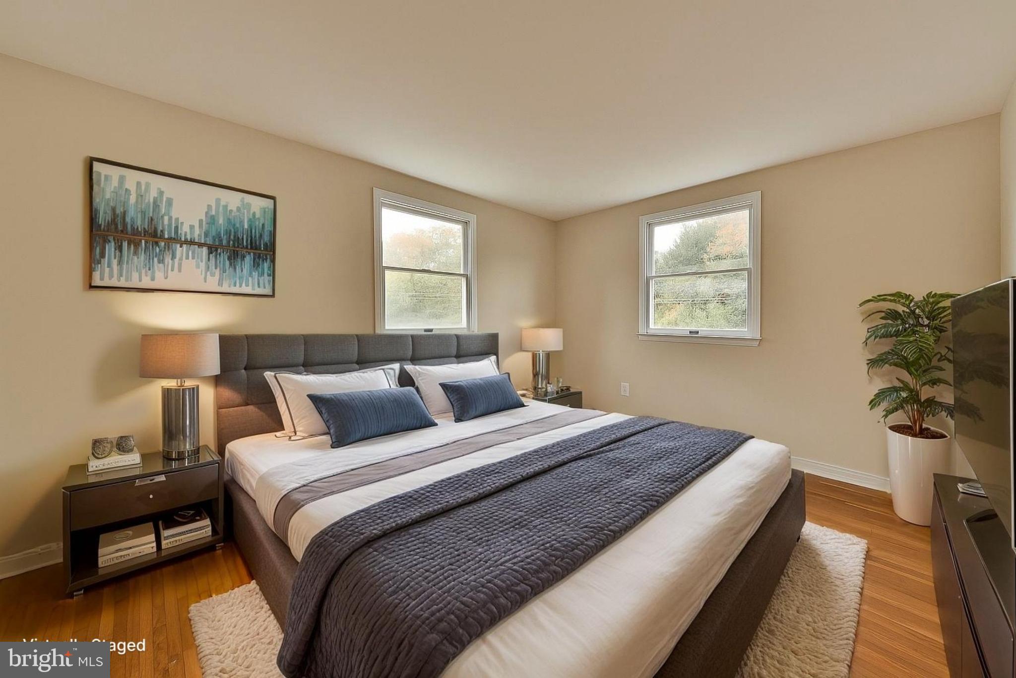 312 East Mill Road Flourtown, PA 19031 - Photo 27 of 36 a bedroom with a bed and wooden floor
