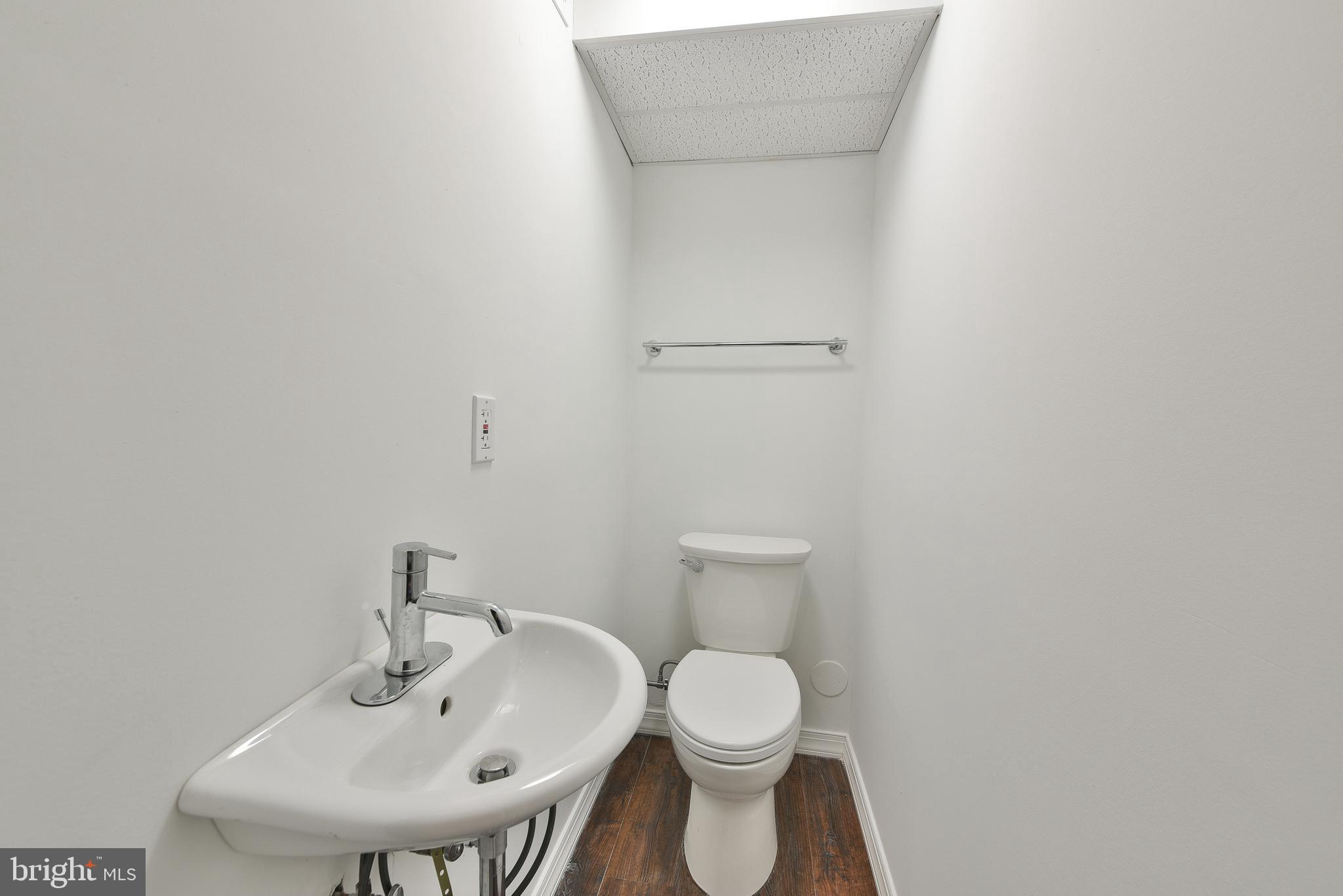 312 East Mill Road Flourtown, PA 19031 - Photo 31 of 36 a bathroom with a toilet sink and mirror