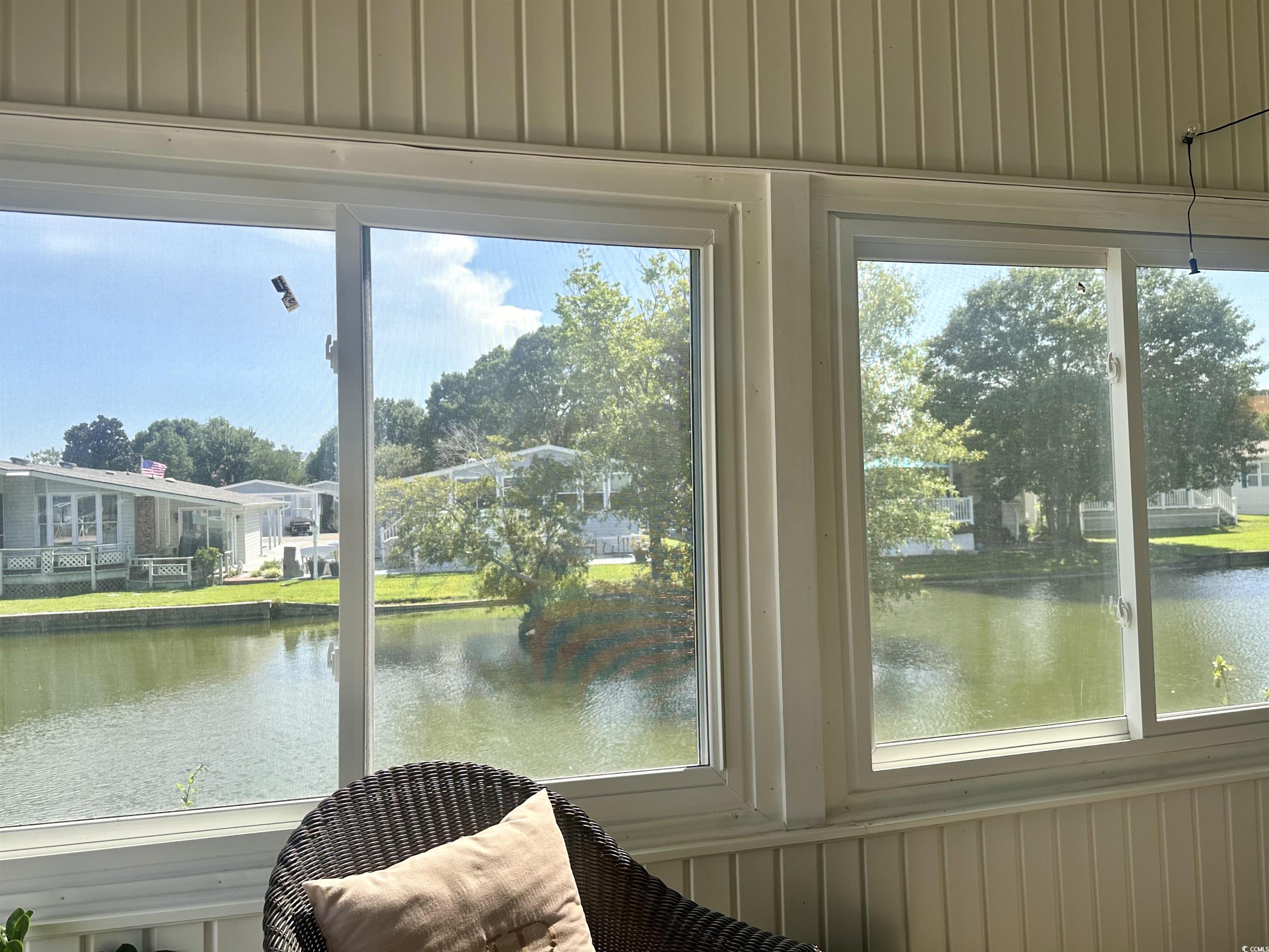 459 Meadowlark Surfside Beach, SC 29575 - Photo 13 of 36 Sunroom featuring a water view
