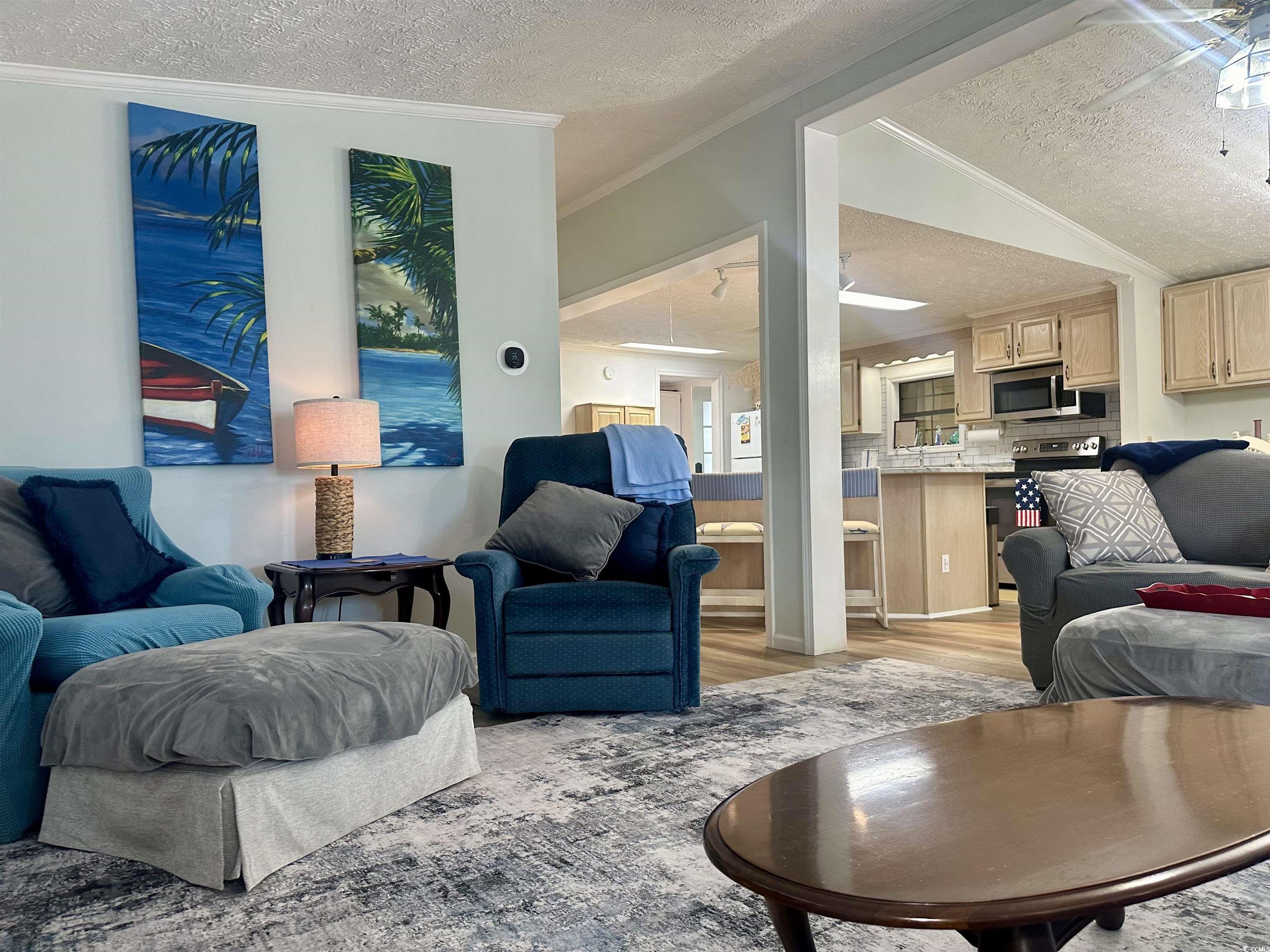 459 Meadowlark Surfside Beach, SC 29575 - Photo 15 of 36 Living room with crown molding, a textured ceiling