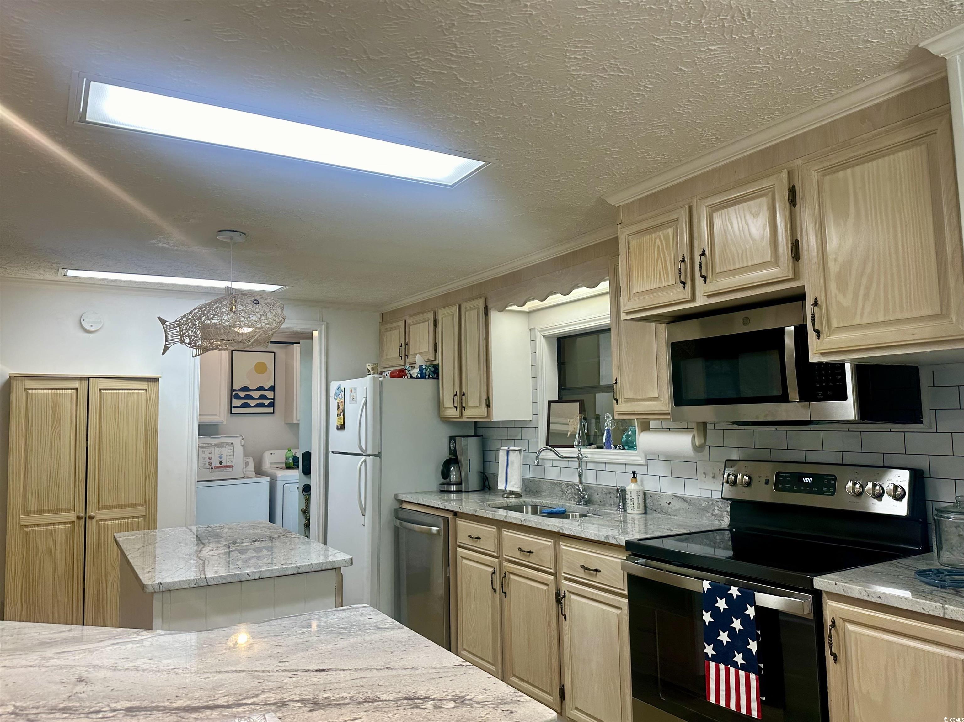 459 Meadowlark Surfside Beach, SC 29575 - Photo 16 of 36 Kitchen featuring stainless steel appliances, wash