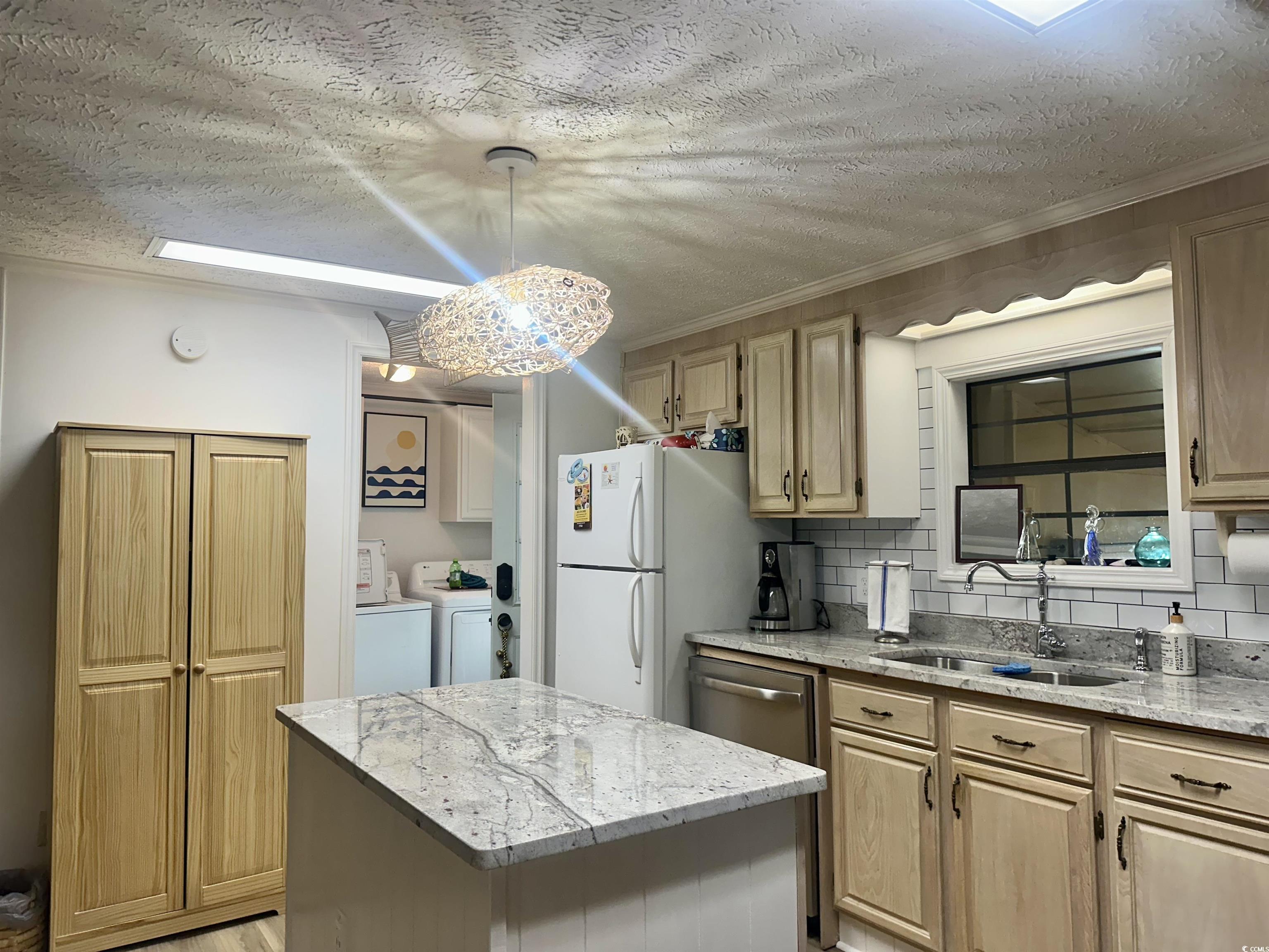 459 Meadowlark Surfside Beach, SC 29575 - Photo 17 of 36 Kitchen with tasteful backsplash, a center island,