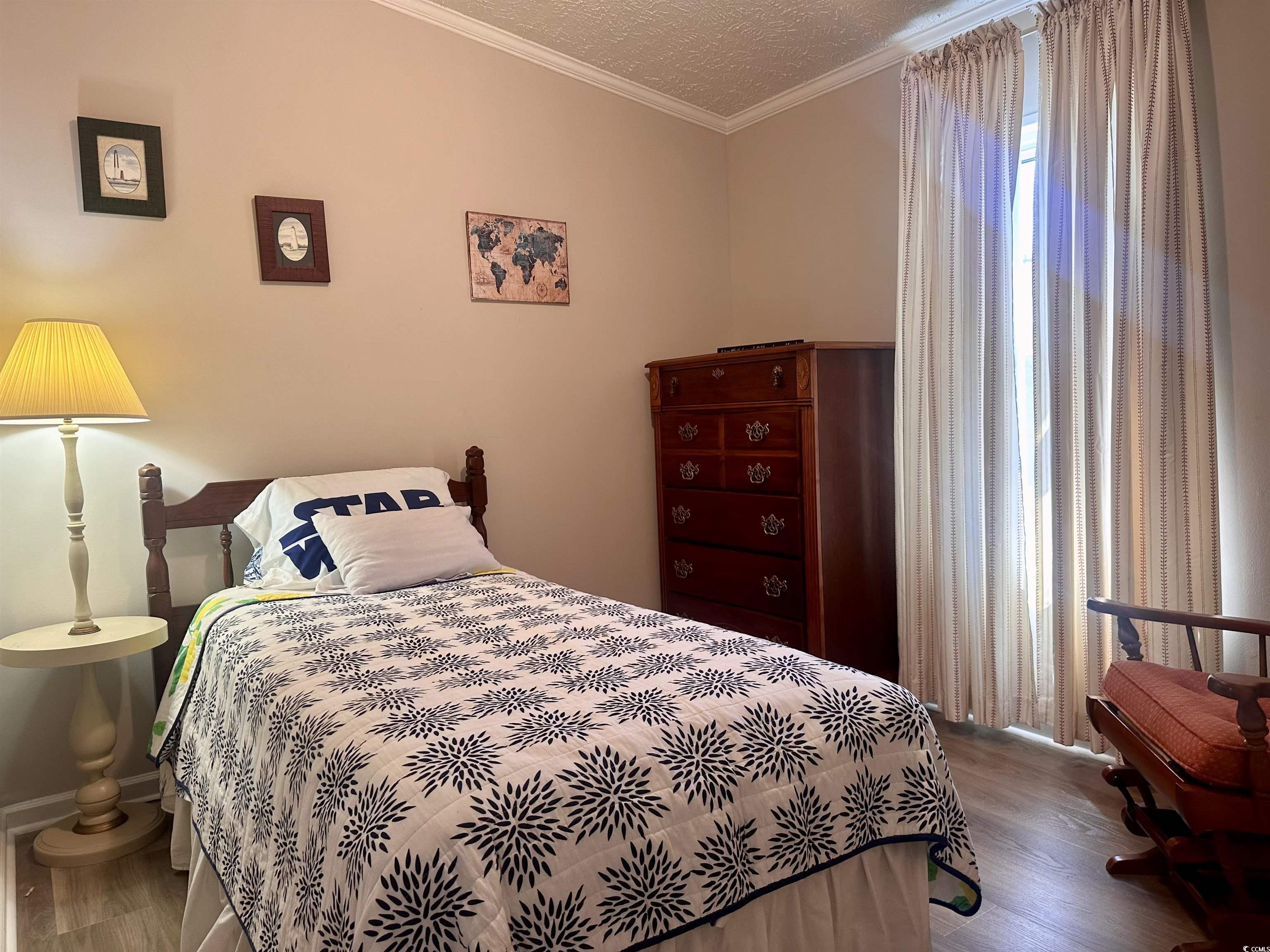 459 Meadowlark Surfside Beach, SC 29575 - Photo 19 of 36 Bedroom with wood-type flooring and crown molding