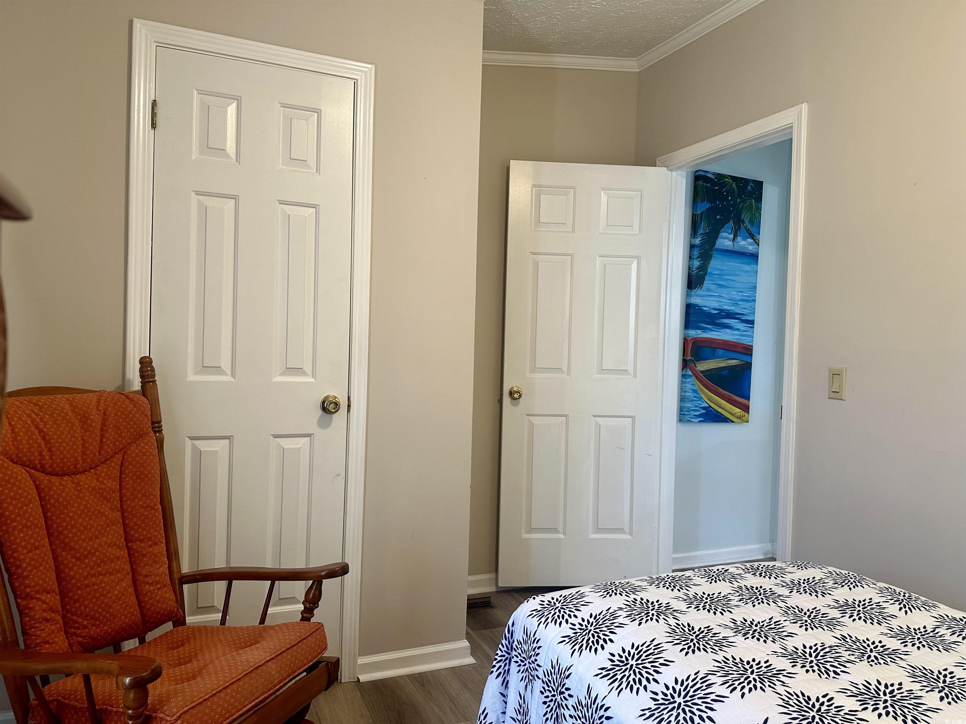 459 Meadowlark Surfside Beach, SC 29575 - Photo 20 of 36 Bedroom featuring ornamental molding, a textured c