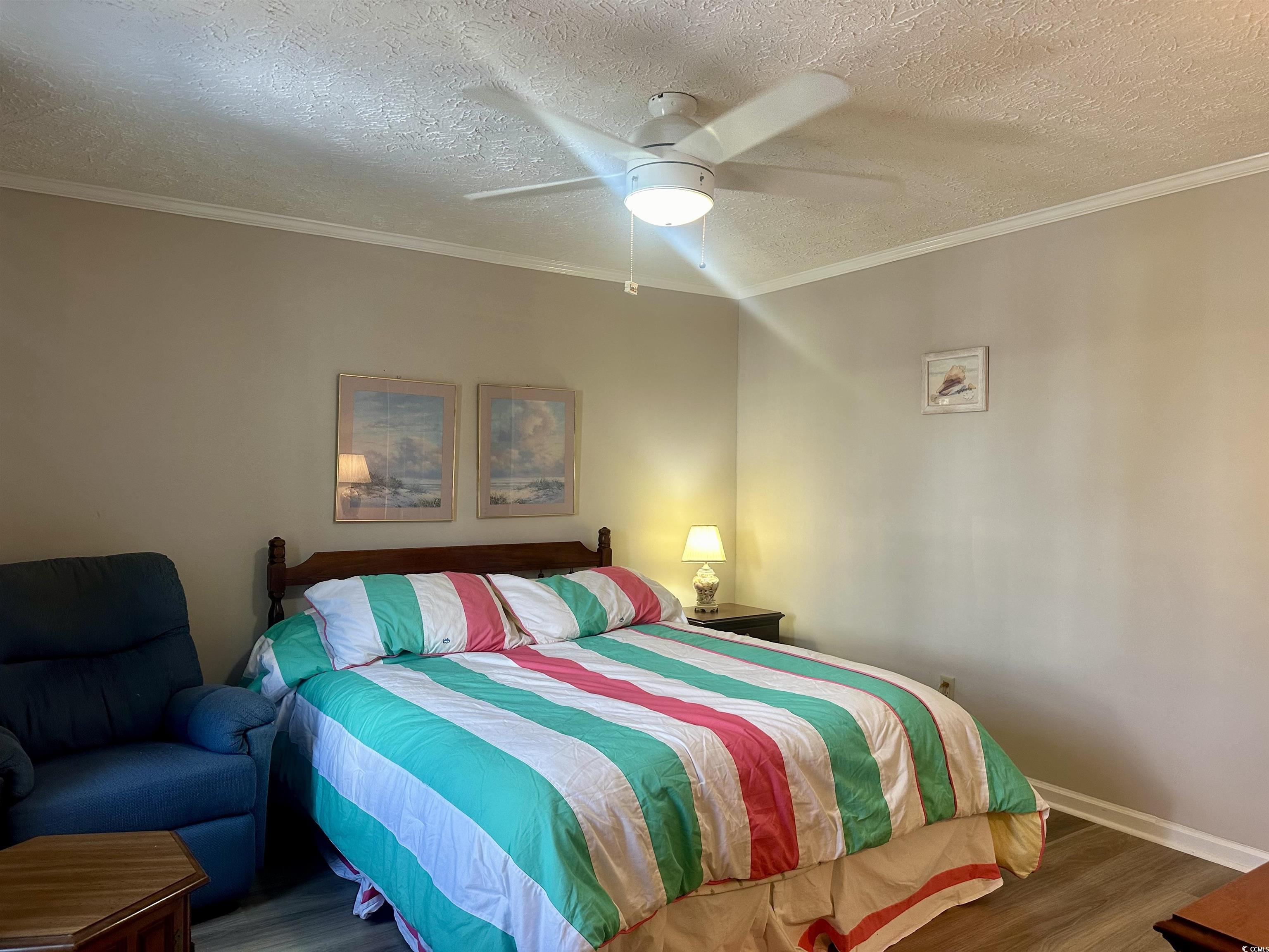 459 Meadowlark Surfside Beach, SC 29575 - Photo 23 of 36 Bedroom with ornamental molding, a textured ceilin