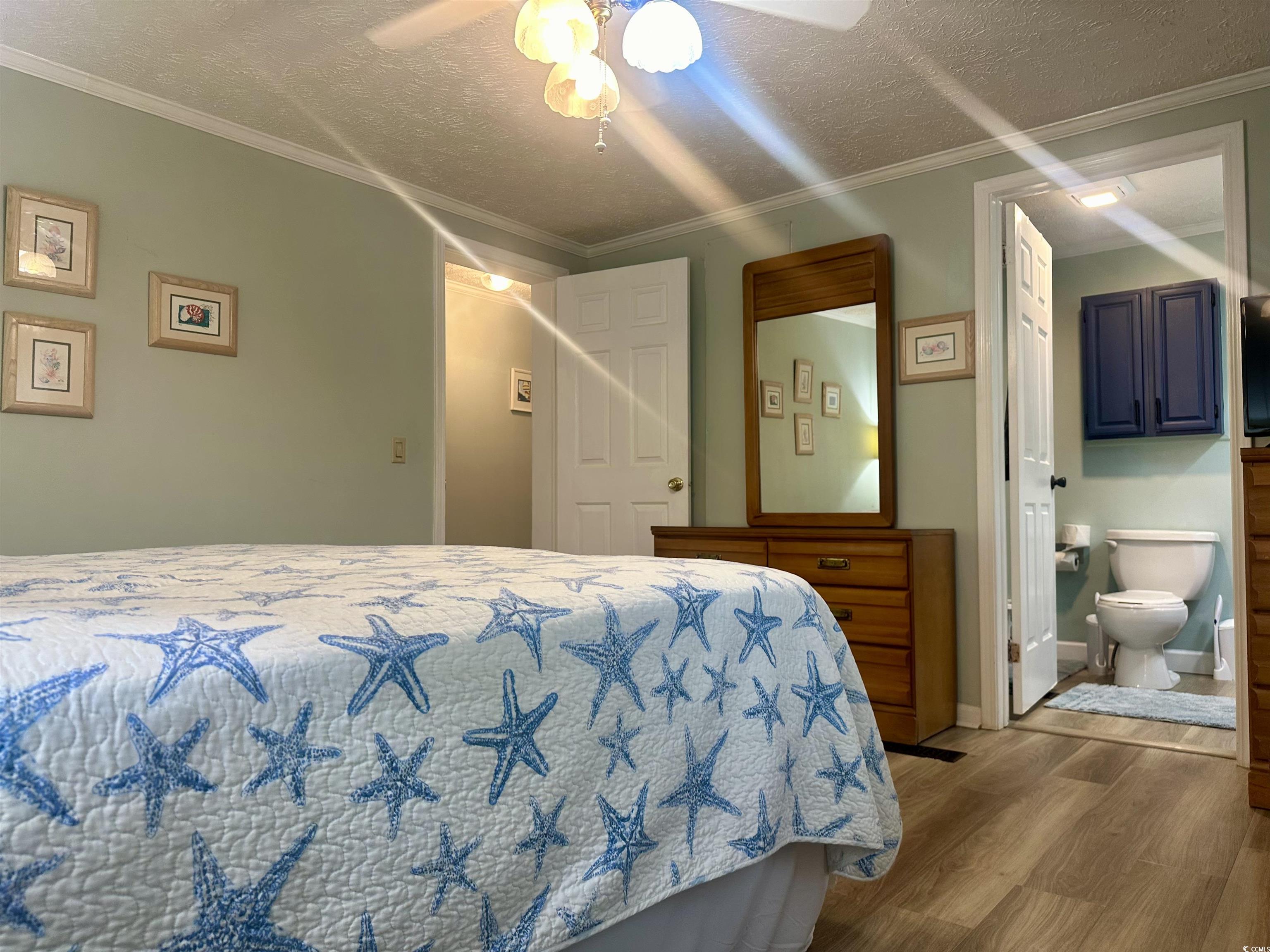 459 Meadowlark Surfside Beach, SC 29575 - Photo 27 of 36 Bedroom featuring light wood-type flooring, a text