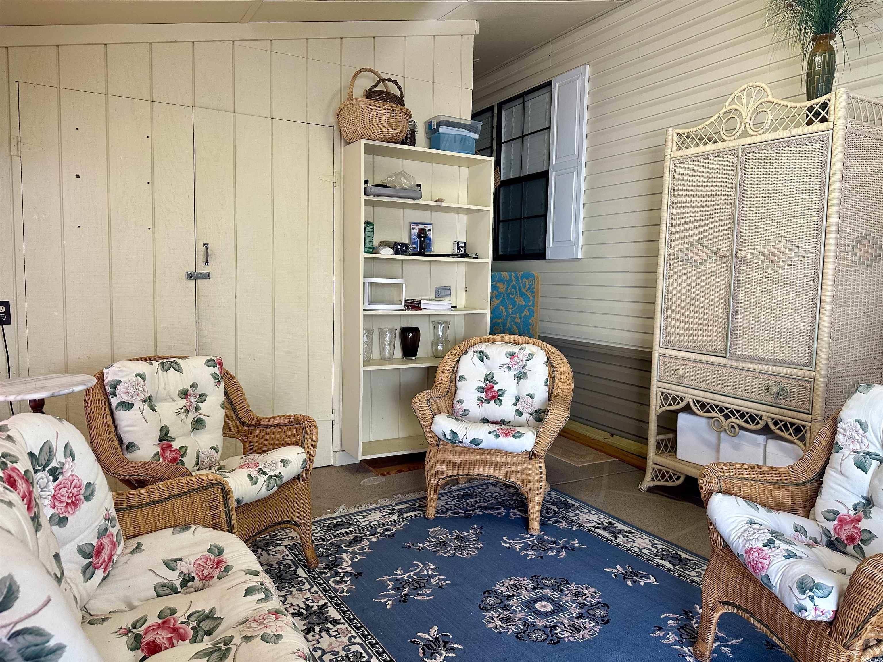 459 Meadowlark Surfside Beach, SC 29575 - Photo 29 of 36 Sitting room featuring vaulted ceiling, wood walls