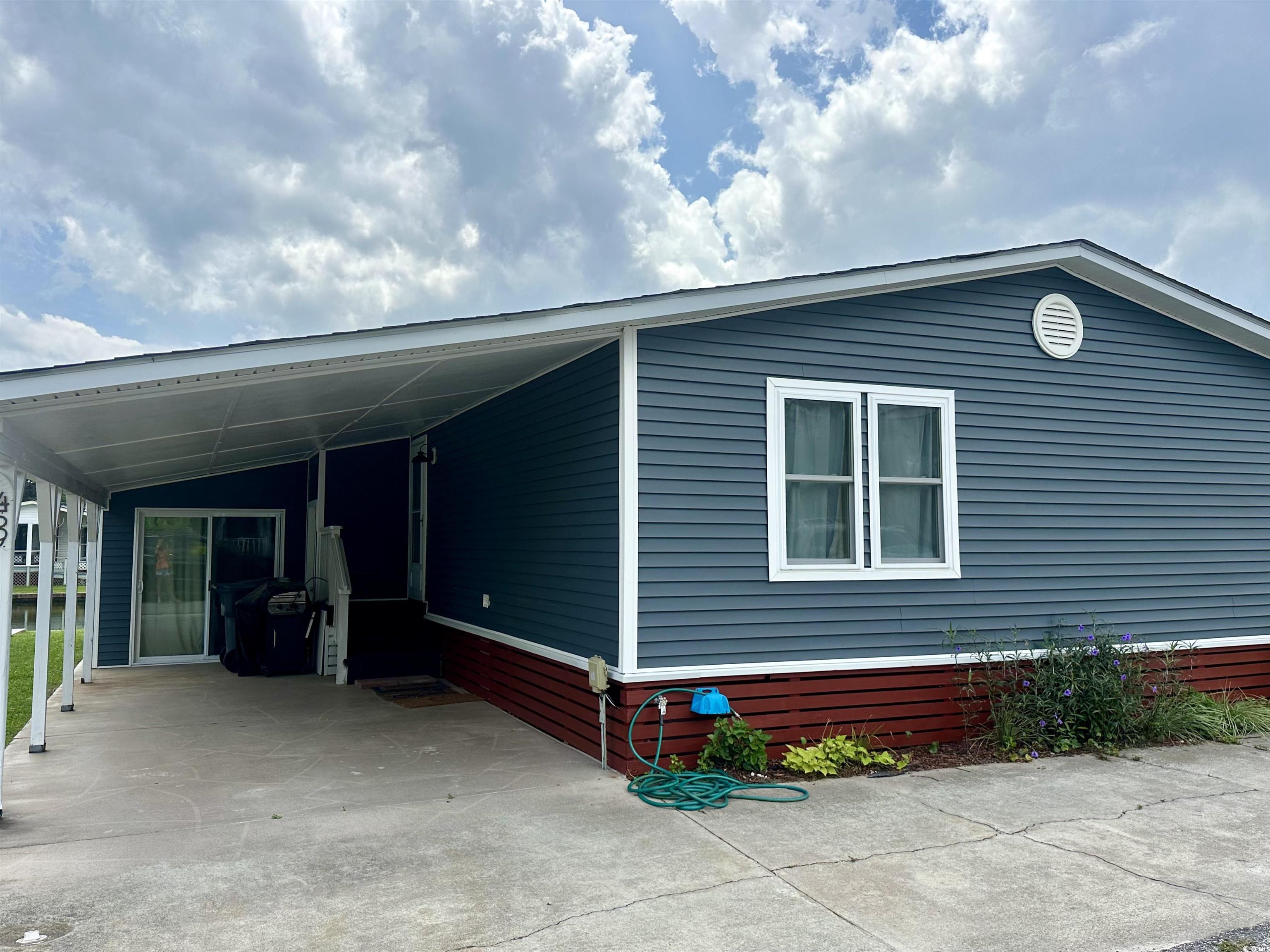 459 Meadowlark Surfside Beach, SC 29575 - Photo 31 of 36 View of home's exterior with a carport