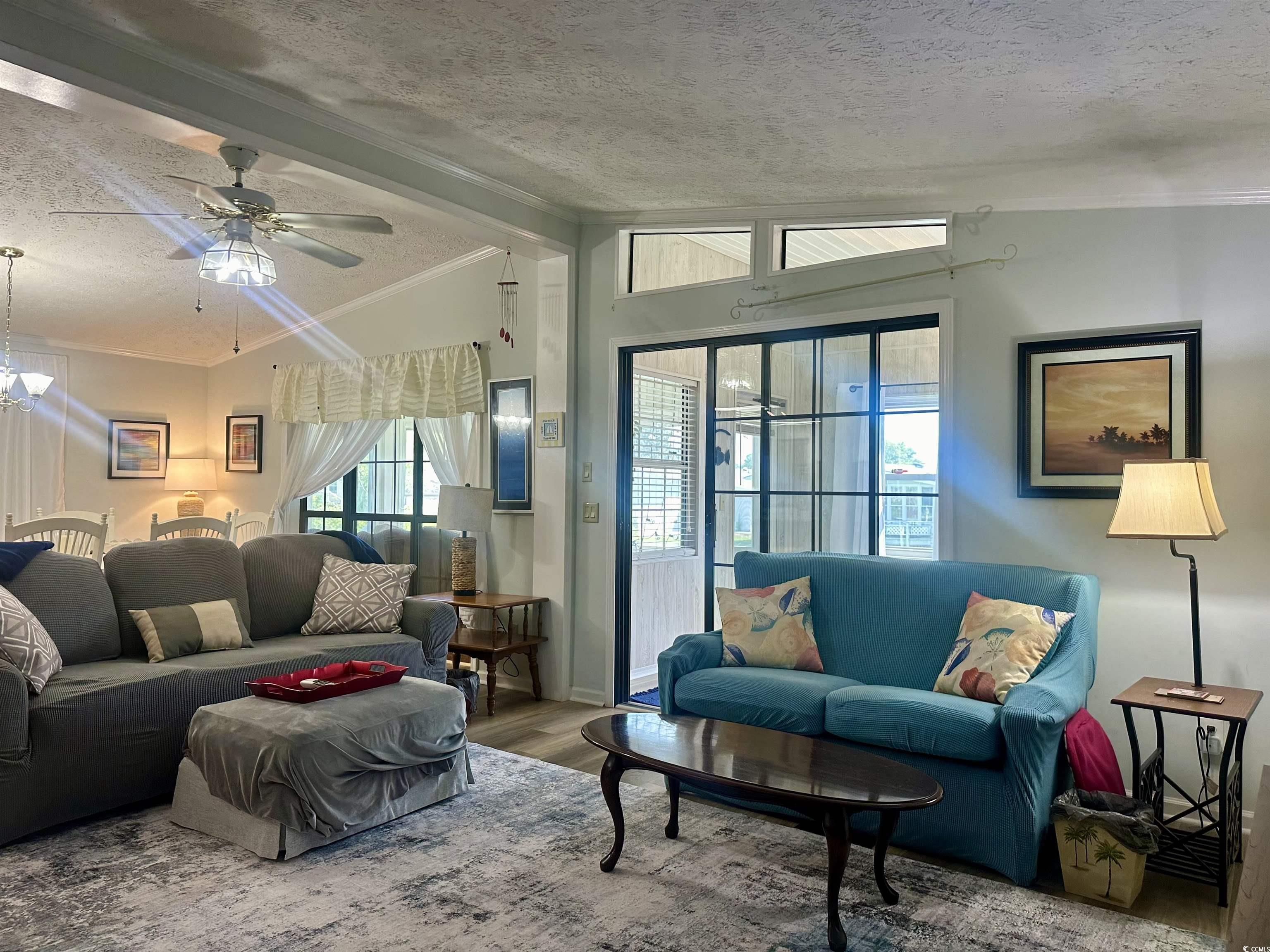 459 Meadowlark Surfside Beach, SC 29575 - Photo 8 of 36 Living room with a textured ceiling, hardwood / wo