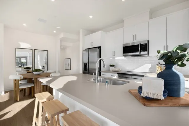 a kitchen with a sink and a microwave