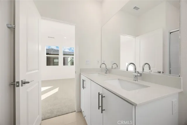 a bathroom with a shower and a glass door