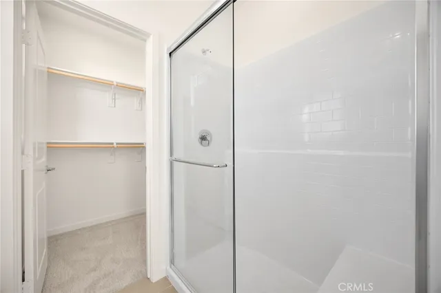 a bedroom with bed and window