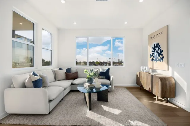 a view of a dining room with furniture and a large window