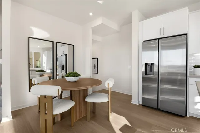 a living room with furniture and large windows