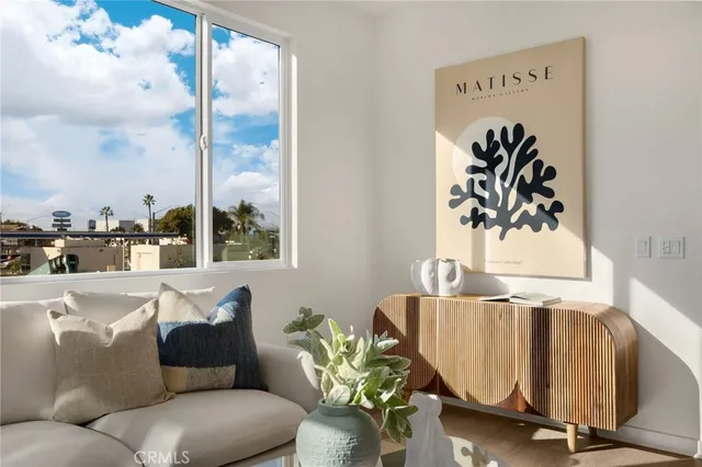 a dining room with kitchen island a table and chairs