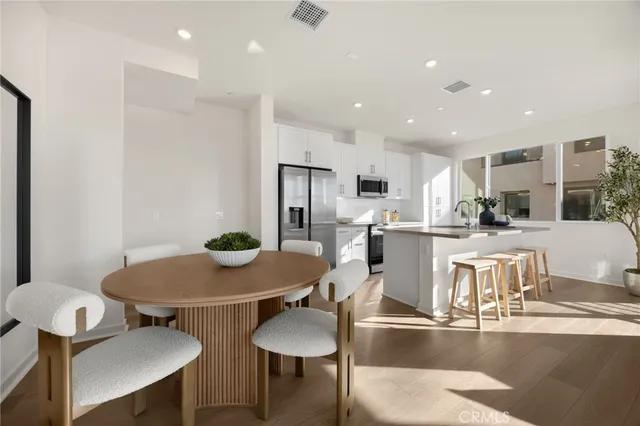 a kitchen with a sink and living room