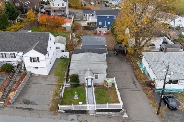 an aerial view of residential houses with outdoor space