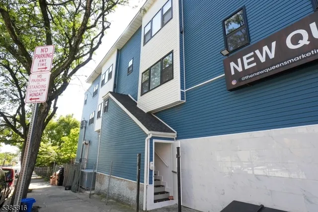 a view of a street with a tree