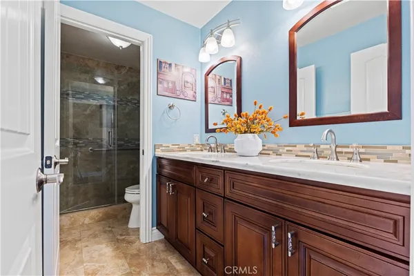 a utility room with sink dryer and washer