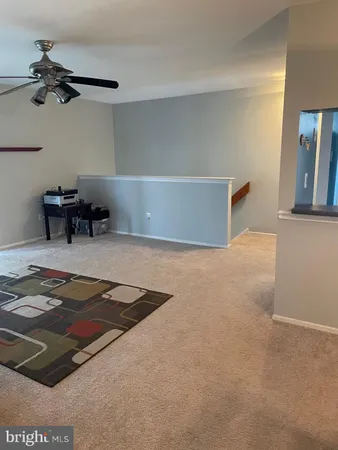 a kitchen with stainless steel appliances a stove a refrigerator and a more cabinets