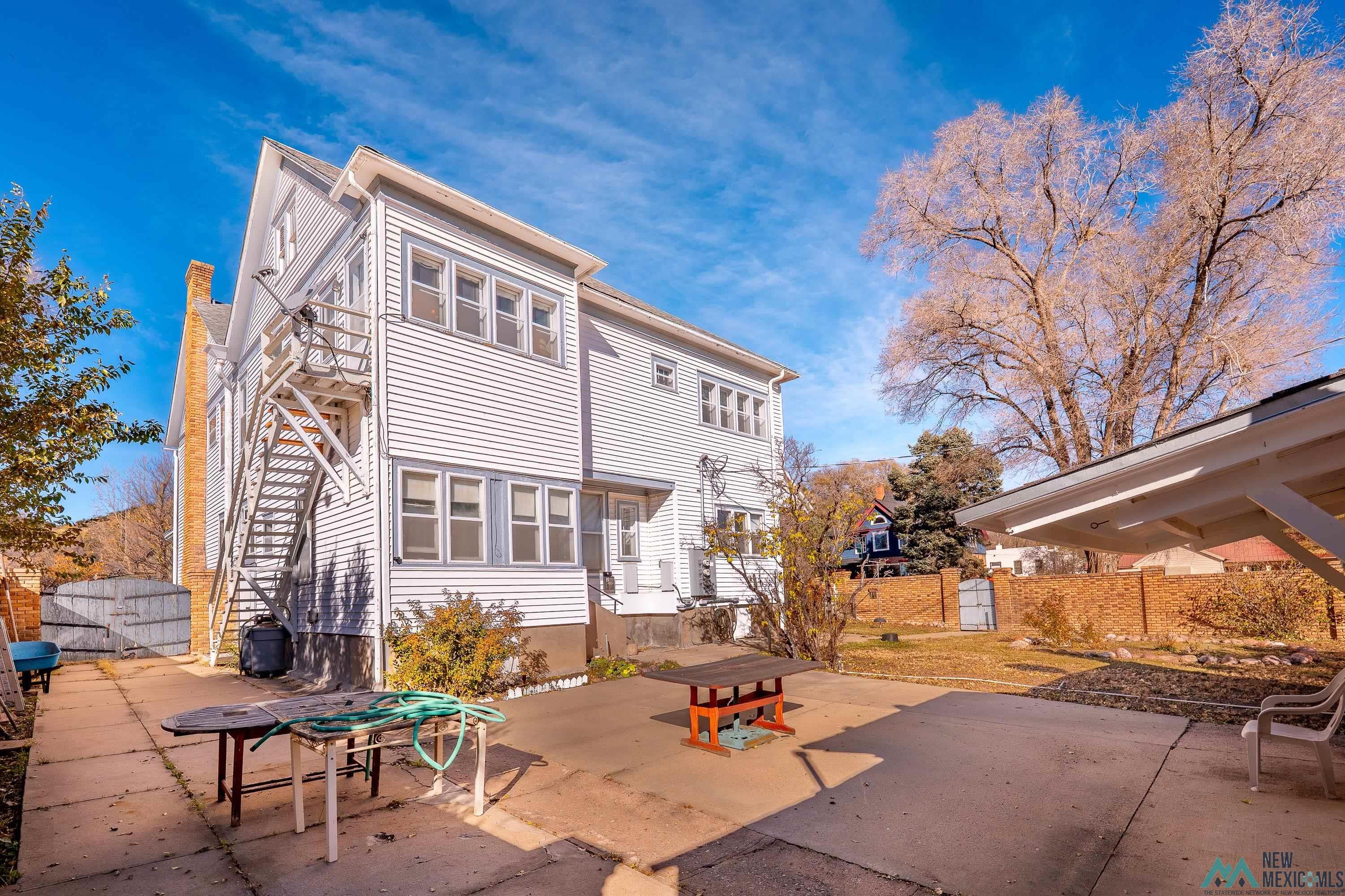301 South 4th Street Raton, NM 87740 - Photo 44 of 78 Back of property with a patio and a gate