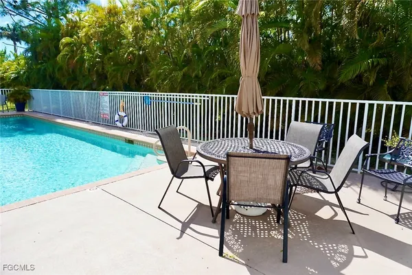 a view of a chairs and table in the yard