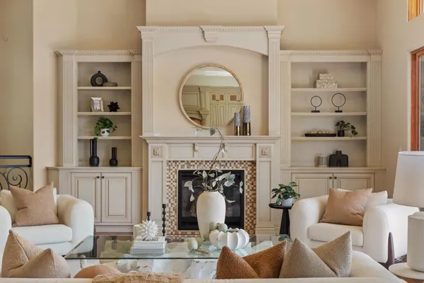 a living room with furniture a window and fireplace