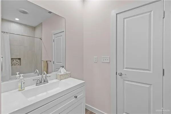 an aerial view of a house with outdoor space and lake view