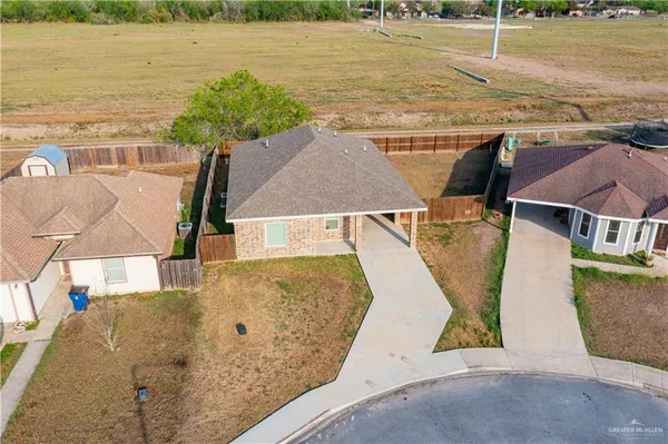 an aerial view of a house with swimming pool