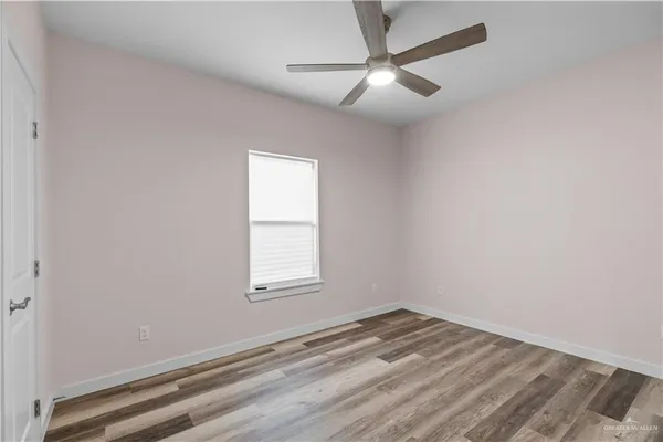a bedroom with two beds and a chandelier