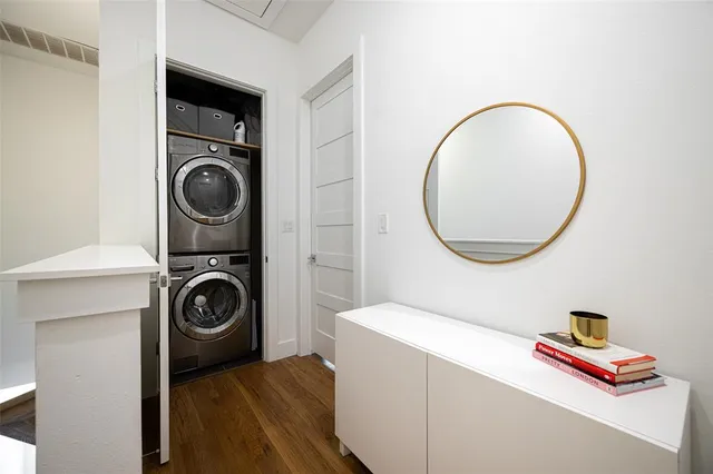 a view of a storage and utility room with washer and dryer