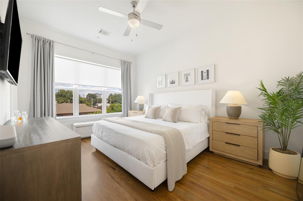 1727 Caddo Street, Unit 103 Dallas, TX 75204 - Photo 18 of 27 a bedroom with a large bed and a window