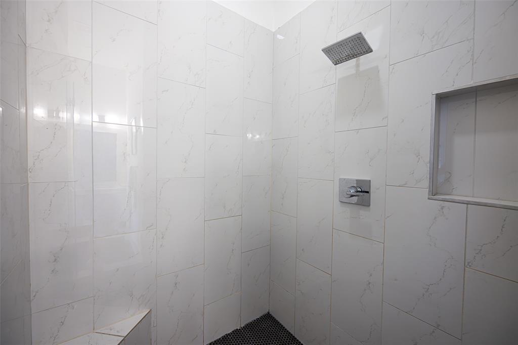 1727 Caddo Street, Unit 103 Dallas, TX 75204 - Photo 21 of 27 a bathroom with a shower