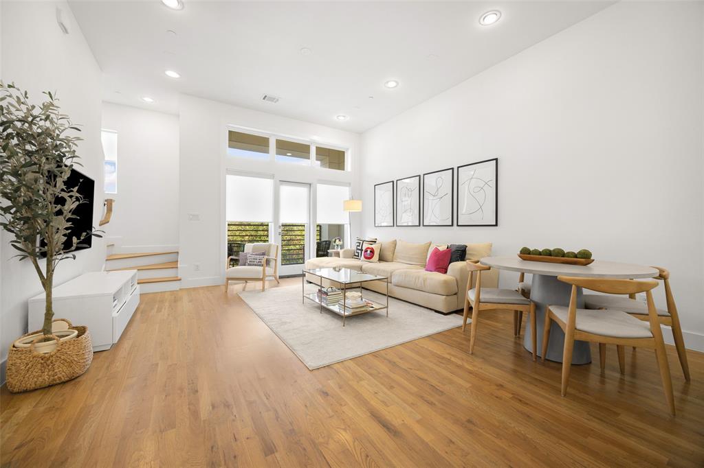 1727 Caddo Street, Unit 103 Dallas, TX 75204 - Photo 6 of 27 a living room with furniture and a large window