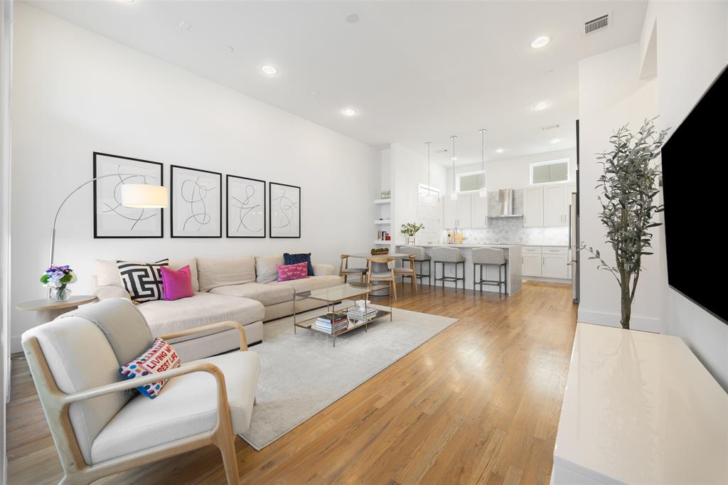 1727 Caddo Street, Unit 103 Dallas, TX 75204 - Photo 8 of 27 a living room with furniture and a flat screen tv