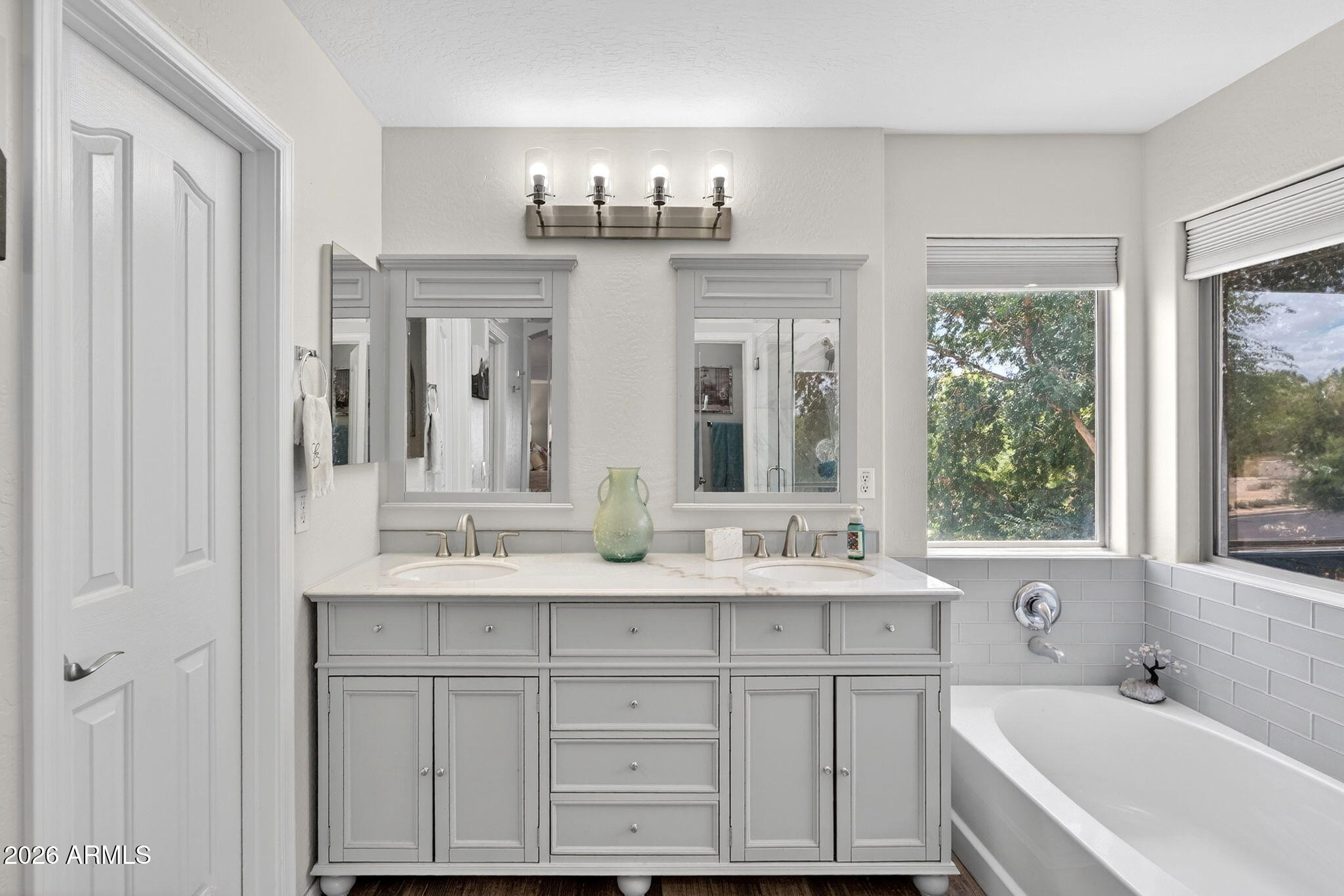 6280 South Sinova Court Gilbert, AZ 85298 - Photo 39 of 64 a bathroom with a sink double vanity and a bathtub