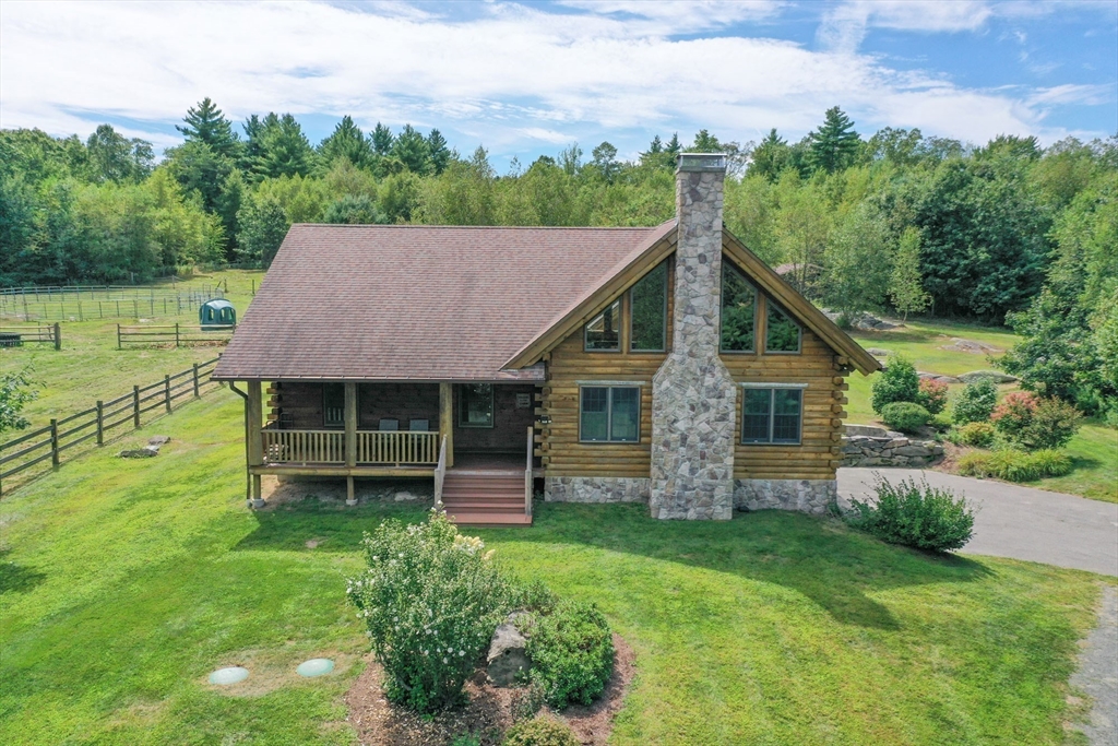 56 Waid Road Monson, MA 01057 - Photo 36 of 41 a front view of a house with a garden and yard