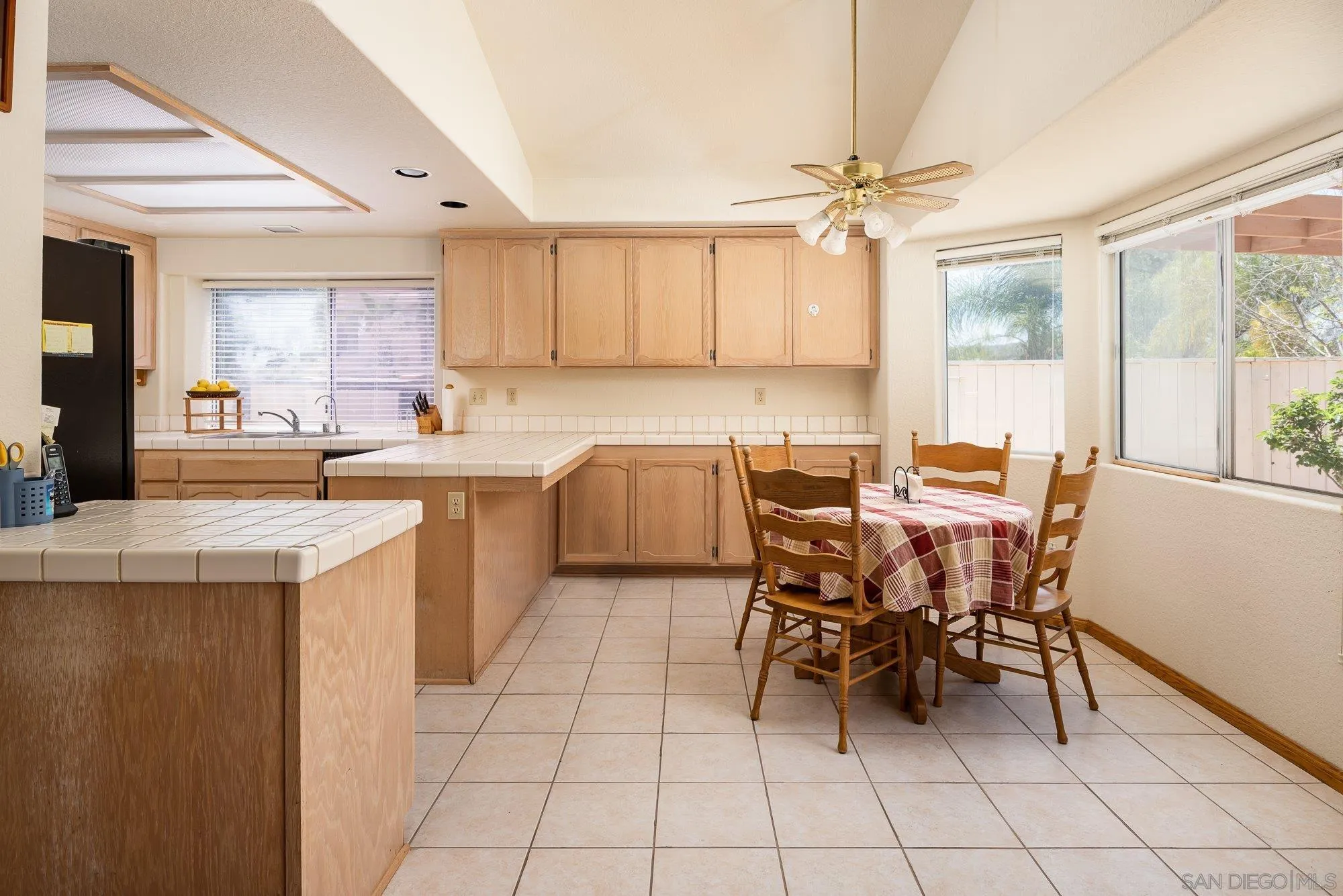 13926 Carriage Road Poway, CA 92064 - Photo 12 of 54 a kitchen with a sink a counter top space appliances and cabinets