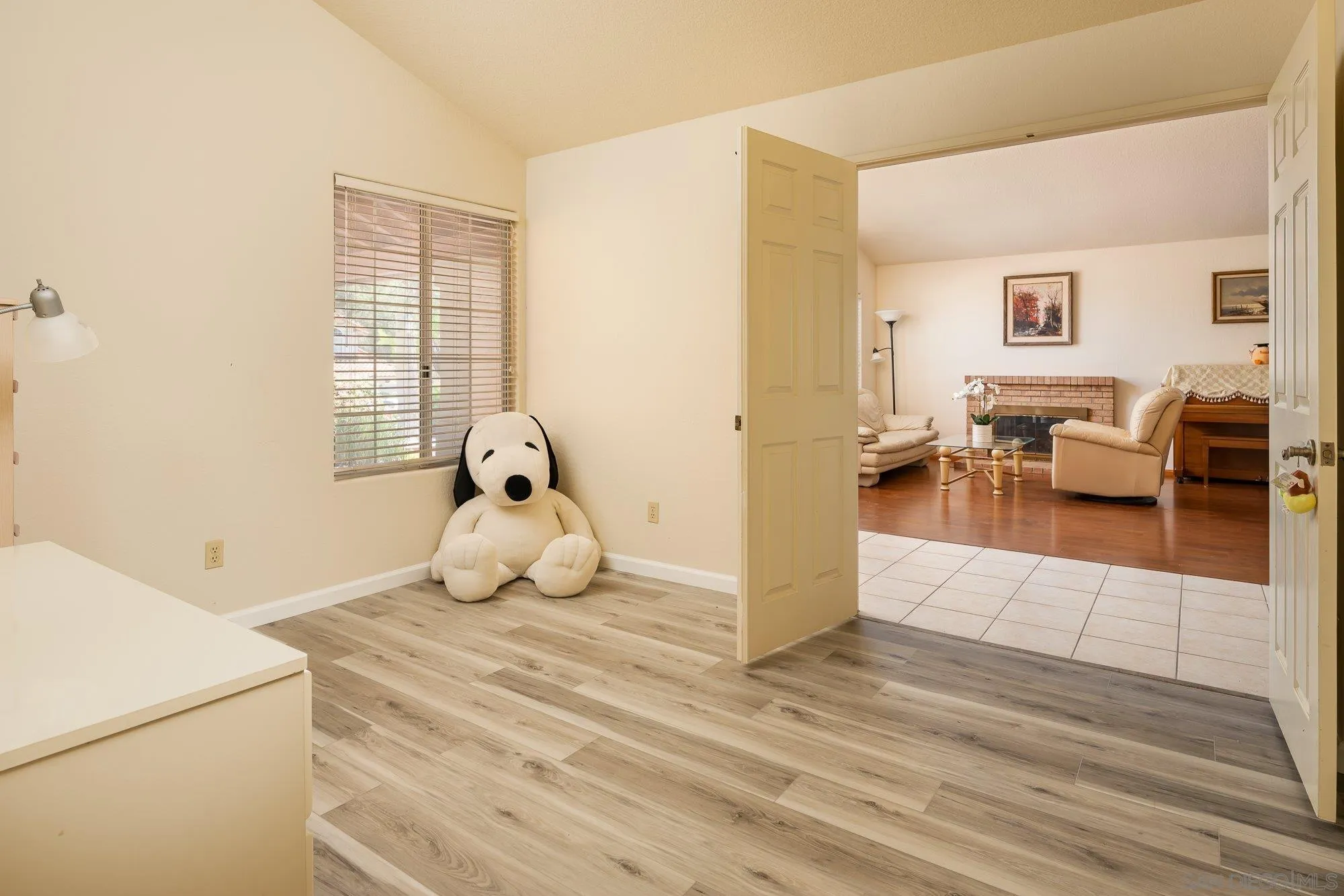 13926 Carriage Road Poway, CA 92064 - Photo 17 of 54 a bedroom with a bed and wooden floor