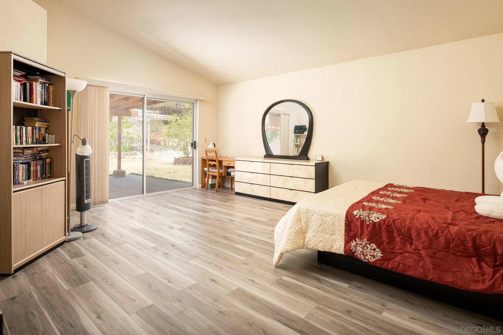 13926 Carriage Road Poway, CA 92064 - Photo 18 of 54 a bedroom with bed and a book shelf