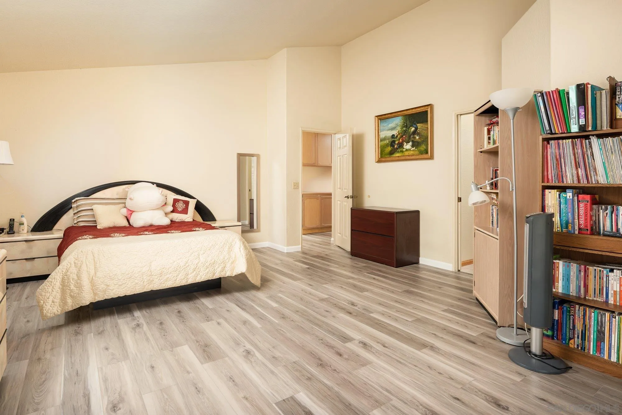 13926 Carriage Road Poway, CA 92064 - Photo 19 of 54 a bedroom with a bed and a book shelf