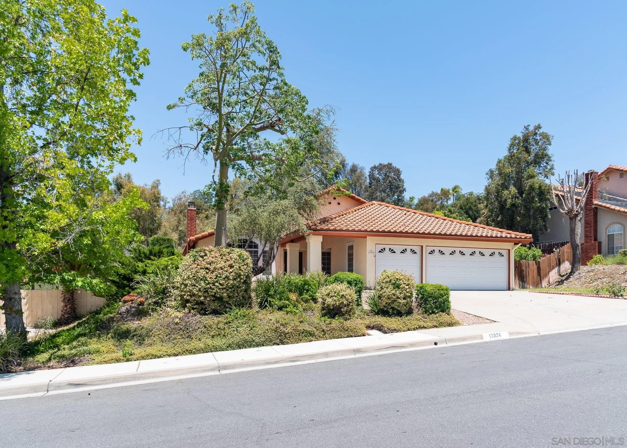 13926 Carriage Road Poway, CA 92064 - Photo 2 of 54 a house with trees in front of it