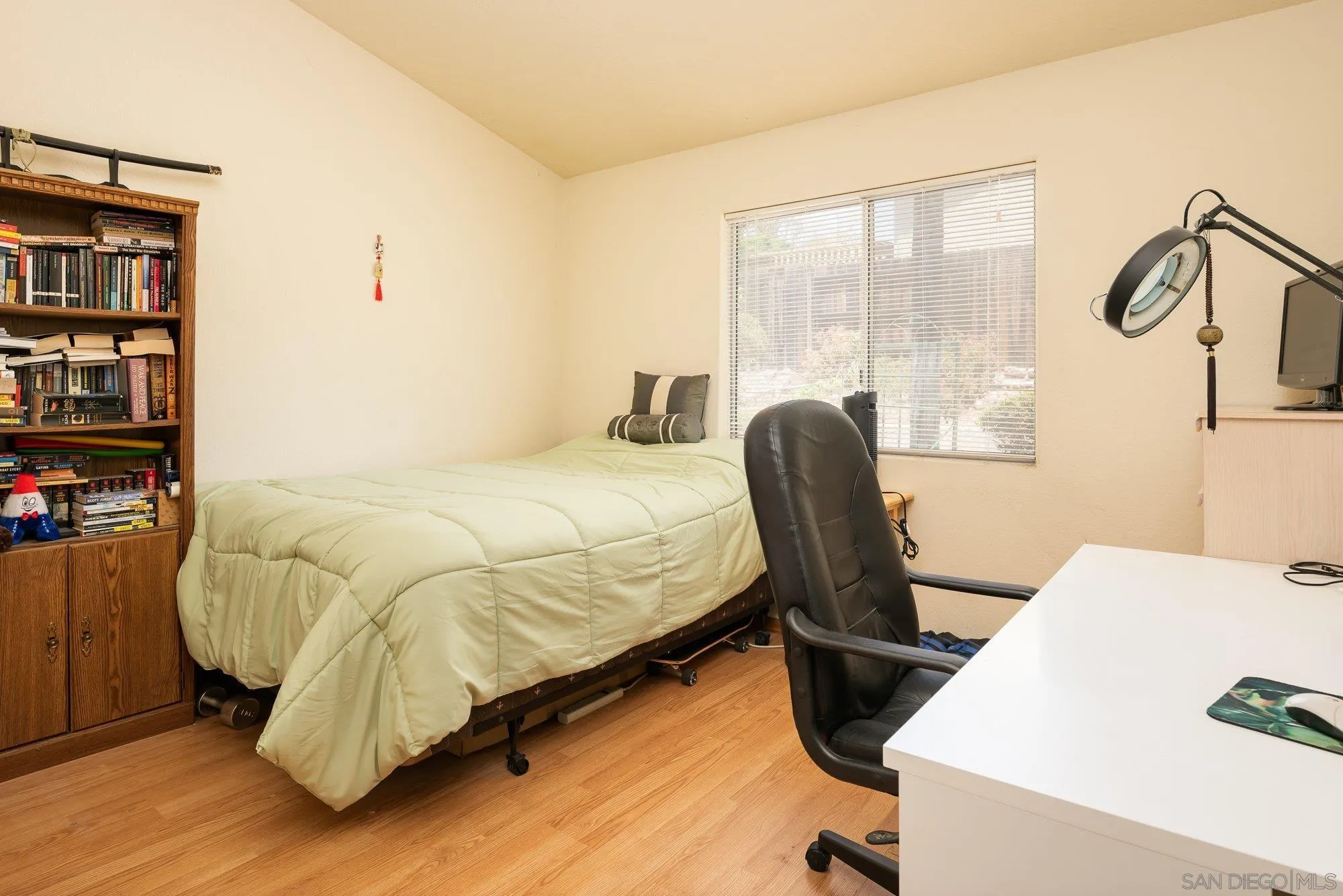 13926 Carriage Road Poway, CA 92064 - Photo 24 of 54 a bedroom with a bed chair and window