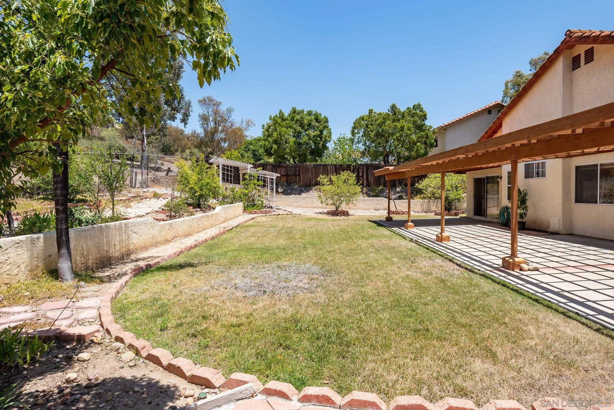 13926 Carriage Road Poway, CA 92064 - Photo 29 of 54 a swimming pool with trees in the background