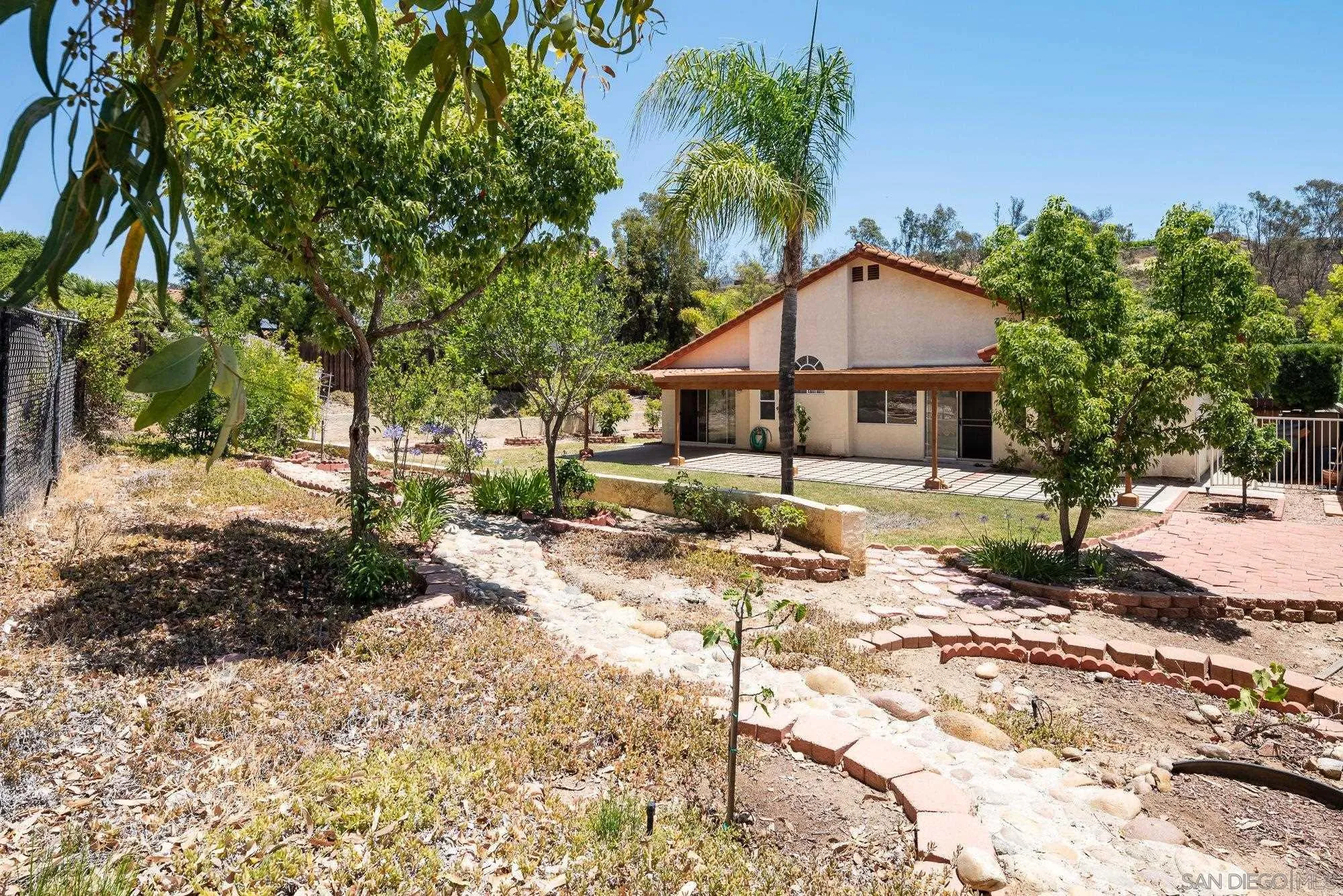 13926 Carriage Road Poway, CA 92064 - Photo 30 of 54 a front view of a house with a yard