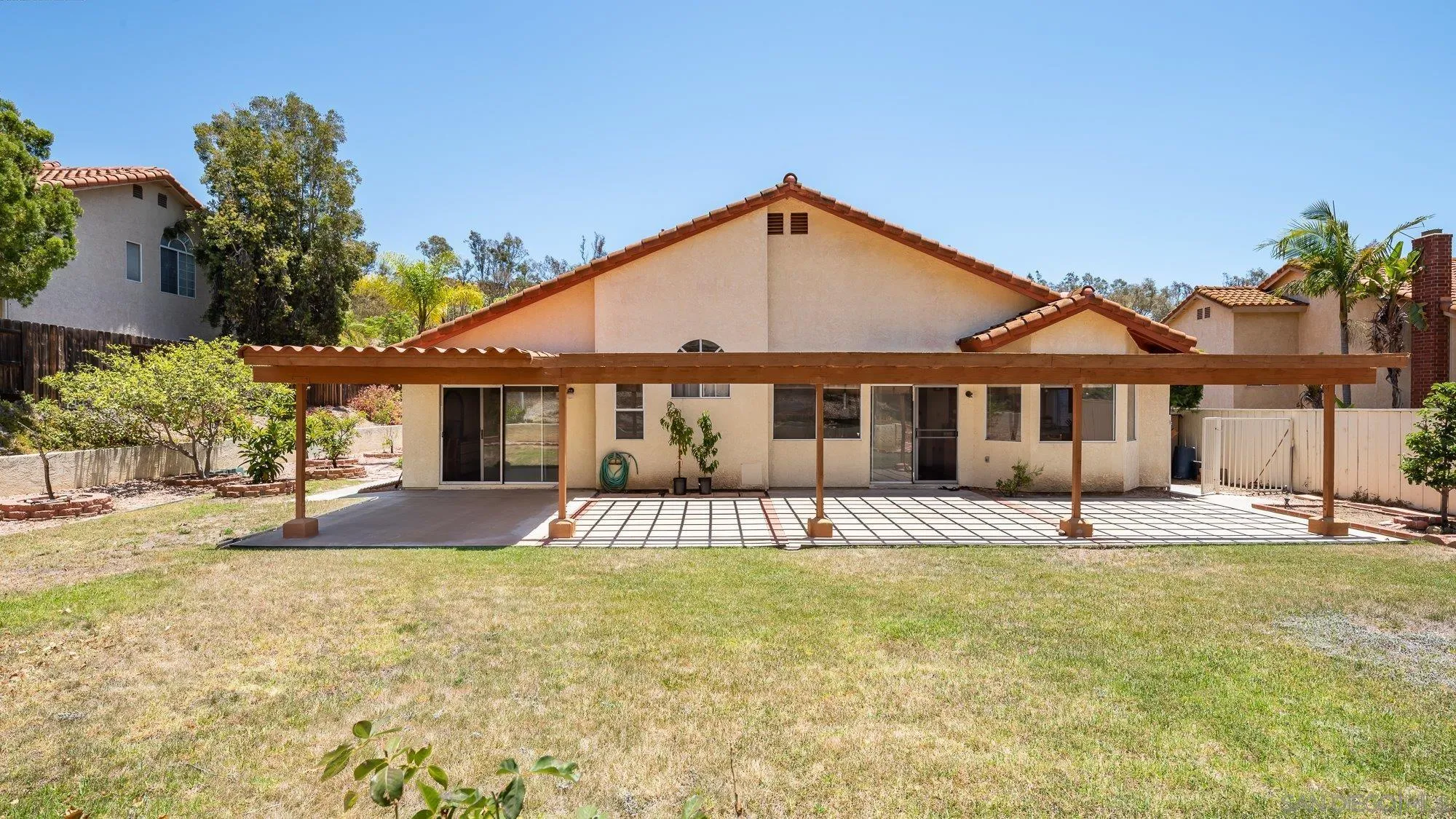 13926 Carriage Road Poway, CA 92064 - Photo 34 of 54 a front view of a house with a yard
